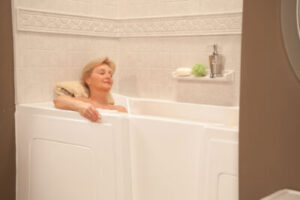 woman relaxing in a large walk-in bathtub